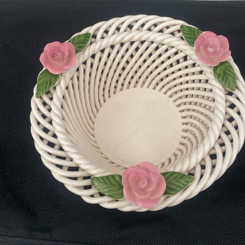 Pretty little woven glass basket with roses trim.